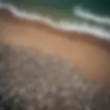 An aerial view of a beach littered with plastic debris